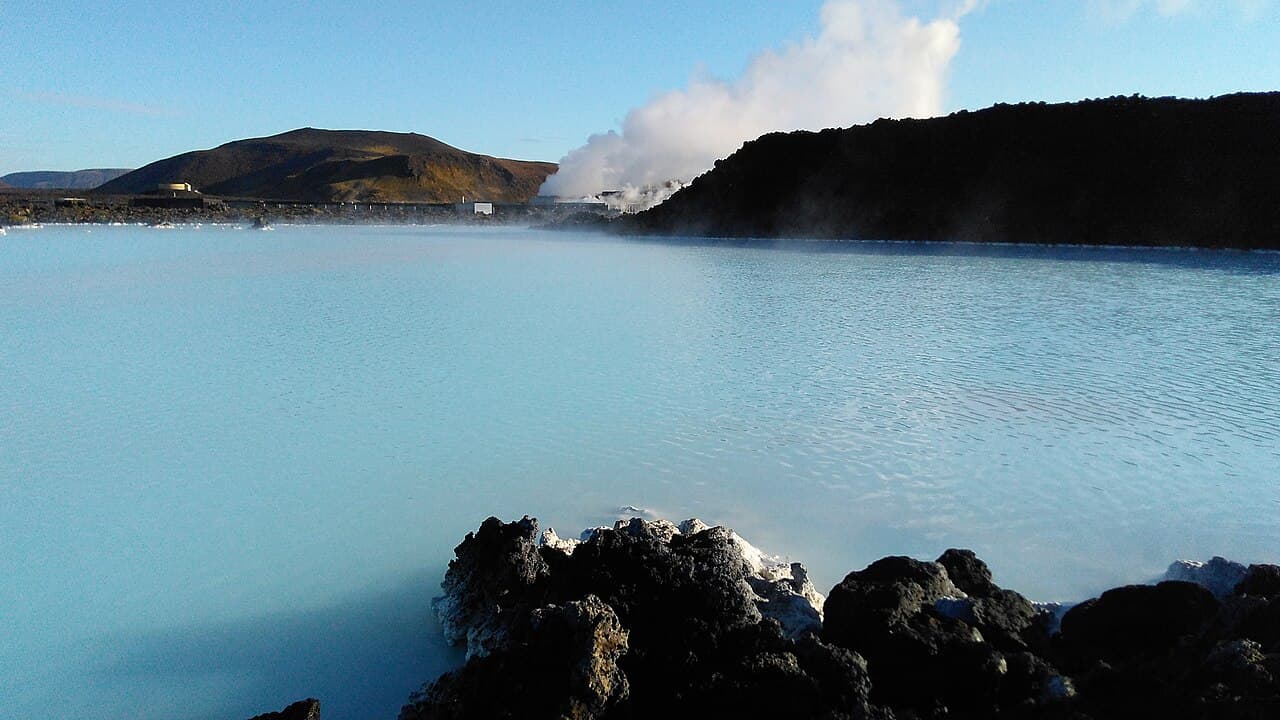 The milky-blue geothermal water and black lava of the Blue Lagoon at Grindavík on the Reykjanes Peninsula